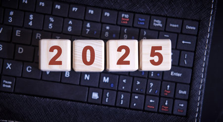 2025 concept. Wooden cubes on a wooden table.の写真素材