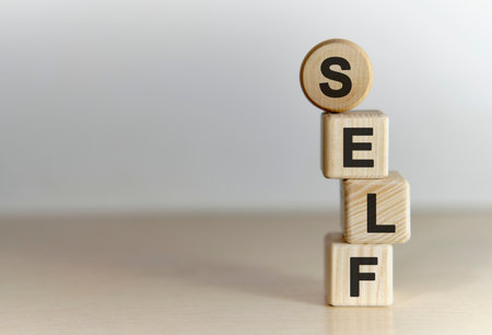 Self concept. Wooden cubes on a backgroundの写真素材