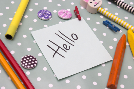 A sticker with an inscription hello on background polka dotsの写真素材