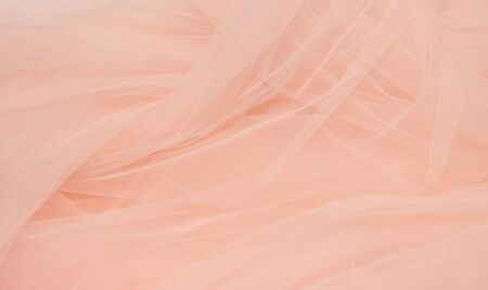 Beautiful layers of gentle pink background with tulle fabric clothesの写真素材