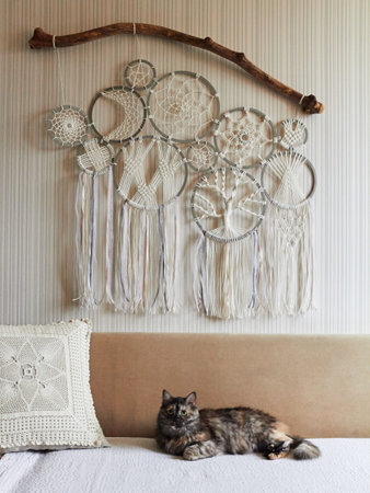 The interior of the room, made in bright colors, decorated with a composition of a cat lying on a...