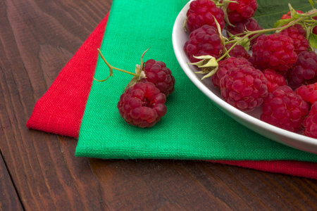 berries of red raspberries in a bowlの写真素材