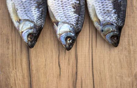 dried fish on a wooden boardの写真素材