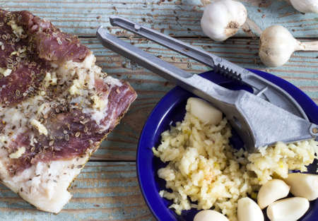 fresh garlic seasoning bacon and spices on the tableの写真素材