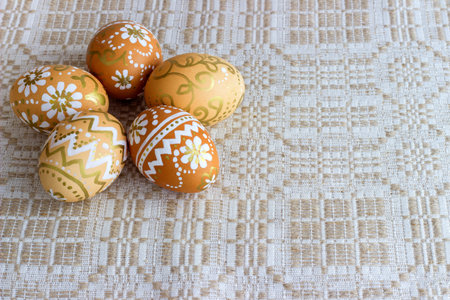 hand-painted Easter eggs on a cloth background