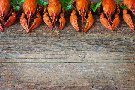 Boiled crayfish on a wooden old  backgroundの写真素材