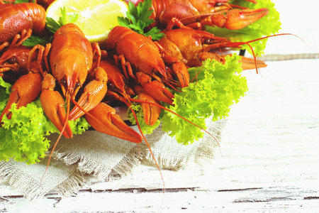 crawfish on wooden white background in a plateの写真素材