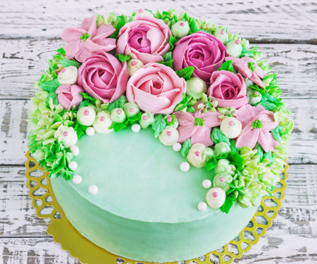 Birthday cake with flowers rose on white background.