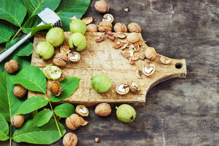 Whole Walnuts and Cleared Black Wooden Background Top view Healthy conceptの写真素材
