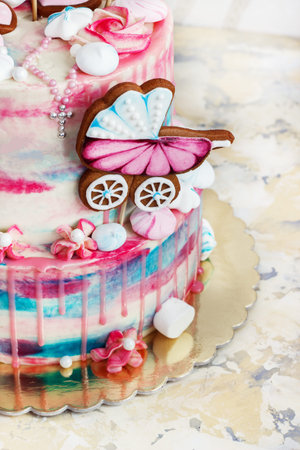 a multi-tier cake for baptism for a girl with gingerbreadの写真素材