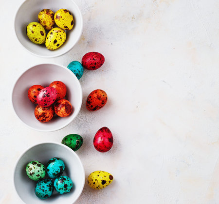 Colored easter eggs on a light background,place for text