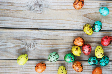 Colored easter eggs on a light background,place for text.