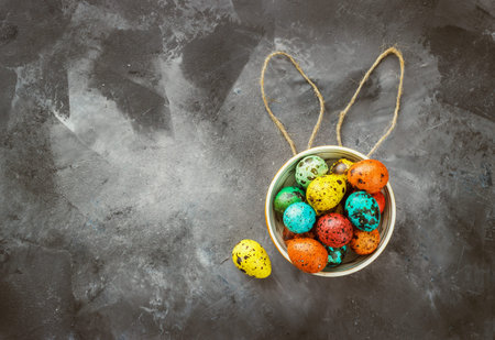Easter colored eggs on a dark background, chalk, ears, Easter concept, inscription, text