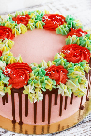 Birthday cake with flowers rose on white background.