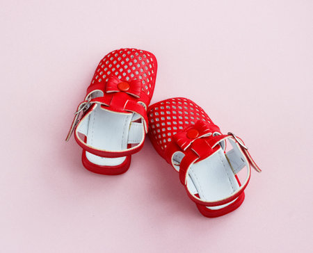 Children's shoes on a pink background