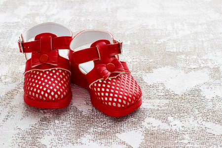 Children's shoes on a light backgroundの写真素材