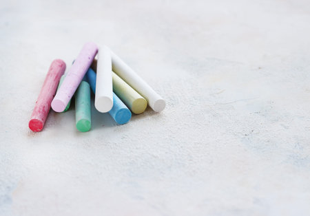 chalks in a variety of colors arranged on a white background