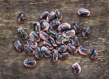 dark beans on a dark wooden background