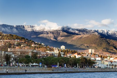 RUSSIA, YALTA - February 4, 2015. Panorama view of Yalta town from the Black sea. Winter sunset. Crimea.のeditorial素材