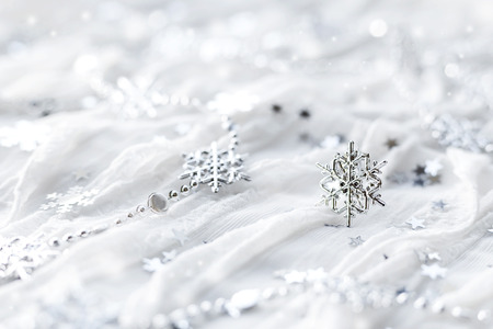 White holiday background with sparkling silver snowflakes, christmas decorations.の写真素材