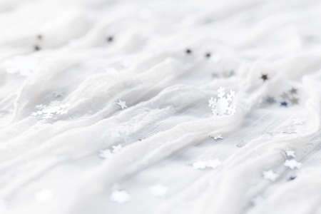 White holiday background with sparkling silver snowflakes, christmas decorations.の写真素材