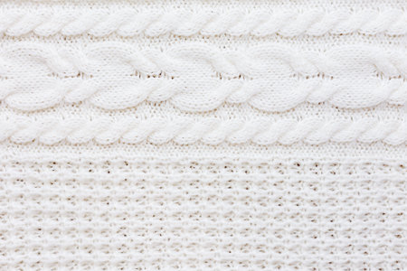 Abstract knitted background. Wool white sweater texture. Close up picture of  knitted pattern.の写真素材