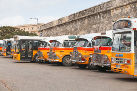 Colorful old British buses from the 60s were used as public transport in Malta.のeditorial素材
