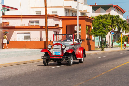 VARADERO, CUBA - February 8, 2008. Classic oldtimer car on street. Most of the Cubans drive cars that were on the road before 1959.のeditorial素材