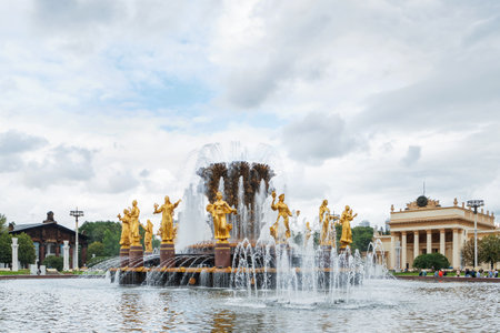 MOSCOW, RUSSIA - July 08, 2016 Fountain "Friendship of the people" at VDNH ("The Exhibition of achievements of national economy"). Golden statues of women represent  republics in the USSR.のeditorial素材