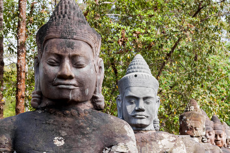 Stone sculptures near South Gate of Angkor Thom from outside the city. Angkor Wat. Siem Reap, Cambodia. UNESCO World Heritage Site.の写真素材