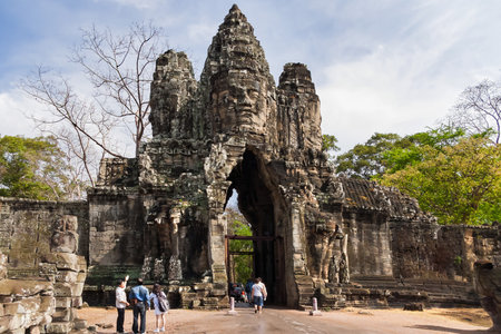 SIEM REAP, CAMBODIA - March 18, 2009. Tourists near South Gate of Angkor Thom from outside the city.のeditorial素材