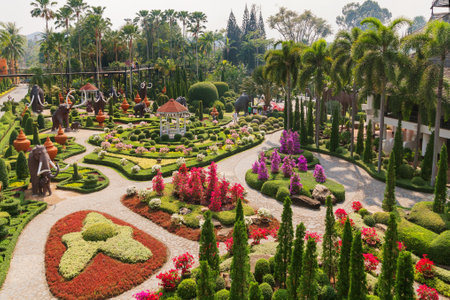 PATTAYA, THAILAND - February 05, 2011. Tourists walk in Nong Nooch Tropical Garden in Pattaya, Thailand.のeditorial素材