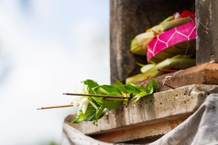 Traditional offerings to the gods. Common religious tradition in the Buddhist and hinduistic countries in Asia.の写真素材