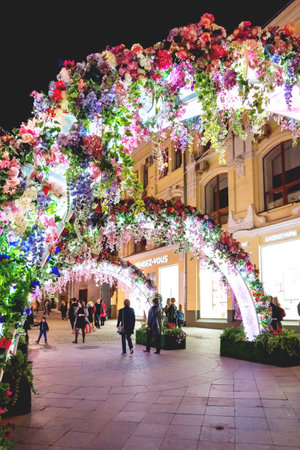 MOSCOW, RUSSIA - May 02, 2016. Street festival Moscow Spring. Flower decoration of colorful fair. People walking in center of city.のeditorial素材