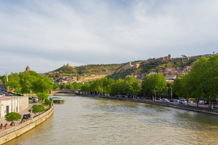 Panorama view on Tbilisi from bridge over Kura river. You can see landmarks - cable road to Narikala...