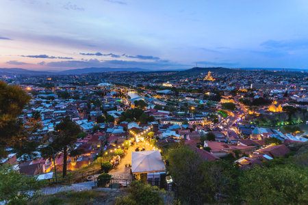 Sunset panorama view of Tbilisi, capital of Georgia country. Metekhi church, Holy Trinity Cathedral...