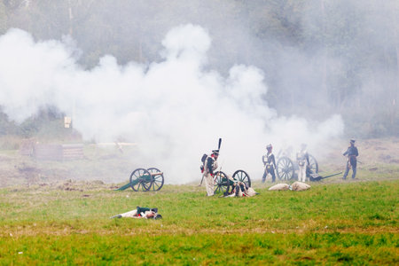 BORODINO, RUSSIA - September 06, 2015 - Reenactment of the battle of Borodino (the Patriotic war of 1812 year). Tourists watch the performance from from the fenced places. Moscow region, Russia.のeditorial素材