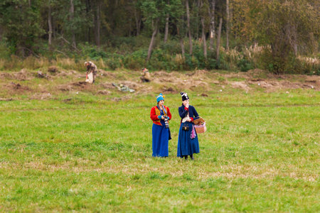 BORODINO, RUSSIA - September 06, 2015 - Reenactment of the battle of Borodino (the Patriotic war of 1812 year). Tourists watch the performance from from the fenced places. Moscow region, Russia.のeditorial素材