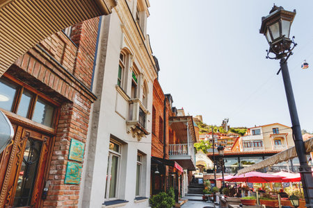 TBILISI, GEORGIA - May 01, 2017. Old part of town with cafe, restaurants, cobbled pavement and antique buildings.のeditorial素材