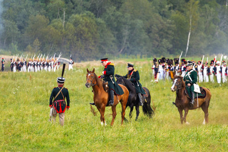 BORODINO, RUSSIA - September 02, 2017 - Reenactment of the battle of Borodino (the Patriotic war of 1812 year). Tourists watch the performance from from the fenced places. Moscow region, Russia.のeditorial素材