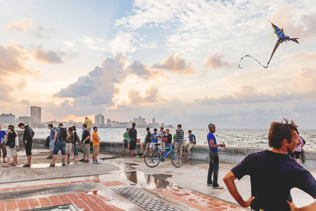 HAVANA, CUBA - February 10, 2008. People meet sunset after storm at famous embankment promenade Malecon.のeditorial素材