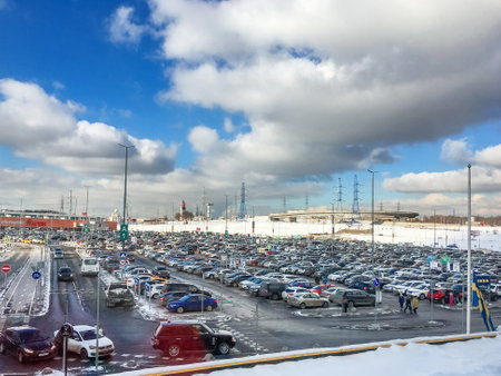 MOSCOW, RUSSIA - February 23, 2018. Lot of cars in the parking lot at a large shopping centre. Lot of people came for shopping in mall at the weekend.のeditorial素材