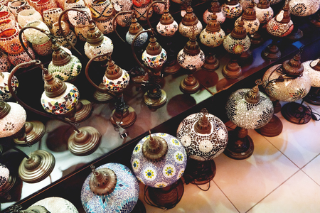 Traditional turkish decorative mosaic lamps. Electric lanterns in shape of old fashioned oil lamps.の写真素材