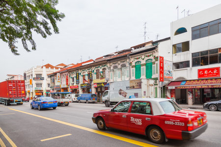 SINGAPORE, SINGAPORE - January 16, 2013. Colonial architecture of city. Buildings with many decorative elements, colorful jalousie and shop signs.のeditorial素材