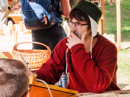 MOSCOW, RUSSIA - August 19, 2018. Man dressed as medieval writer. Annual festival Times and Epochs. Historical reconstruction.のeditorial素材