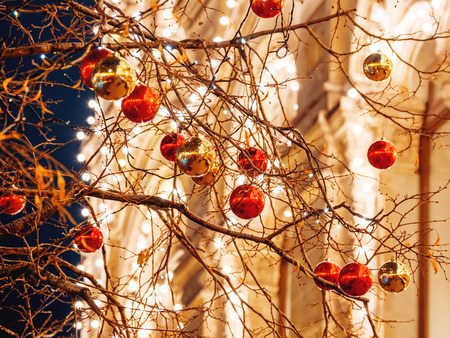 Streets of Moscow decorated for New Year and Christmas celebration. Tree with bright red and yellow balls.の写真素材