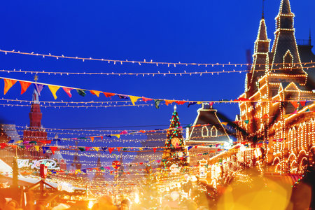 MOSCOW, RUSSIA - December 16, 2017. Red Square decorated for New Year and Christmas fair. Crowd of people near GUM (Main Department Store) building with light bulbs.のeditorial素材