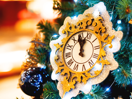 Decorative watch made of spangles. New Year decoration for Christmas tree.の写真素材