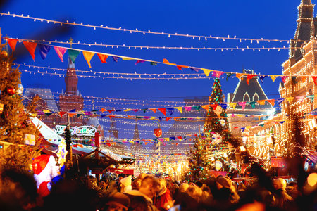 MOSCOW, RUSSIA - December 16, 2017. Red Square decorated for New Year and Christmas fair. Crowd of people near GUM (Main Department Store) building with light bulbs.のeditorial素材