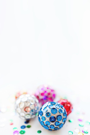 Christmas and New Year background with bright balls. Hand made decorations for Christmas tree with colorful sparkling spangles. Place for text.の写真素材